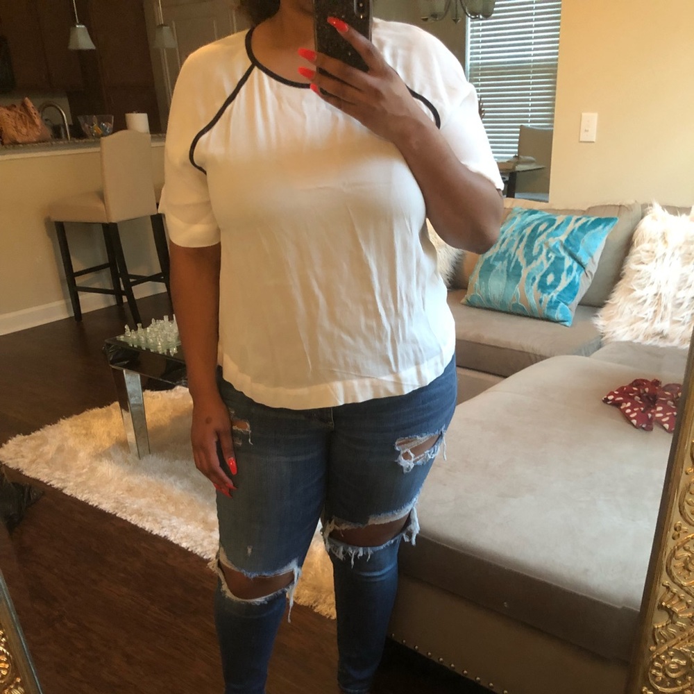 White blouse with black trim